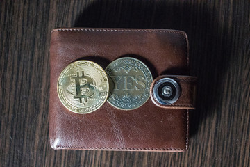 Bitcoin and No coin in a wallet on a wooden background