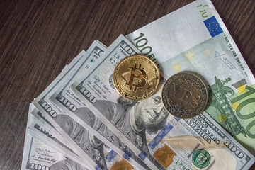 Bitcoin, Euro and dollars on the table with a Coin "Yes"