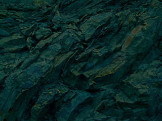 Abstract black  dark blue green emerald background. Toned rock texture.  Modern colorful stone background with 3d effect. Design. Cracked, broken, crashed, crumbled, ruined.
