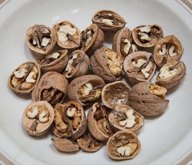 Bowl of walnuts with a thick shell