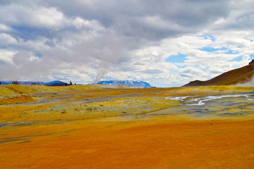 Supernatural landscape at geothermal field Mars like site Hverir Namafjall wasteland with pools of...