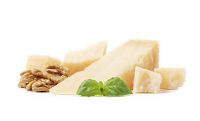 Parmesan slice with walnuts and basil isolated on white background