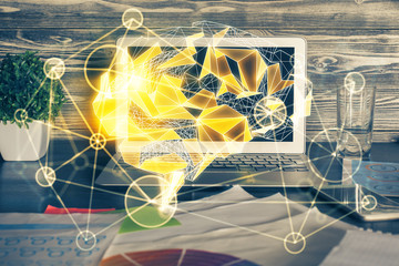 Double exposure of table with computer and brain hologram. Data innovation concept.