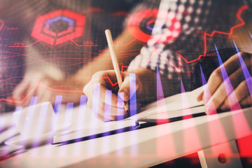 Multi exposure of two men planing investment with stock market forex chart.