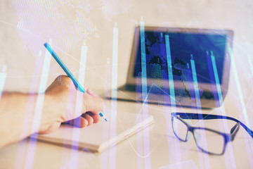 Multi exposure of man hands with stock market forex graph.