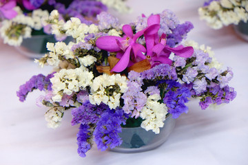 pink and purple bouquet of flowers on white background
