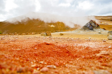 Supernatural landscape at geothermal field Mars like site Hverir Namafjall wasteland with pools of...