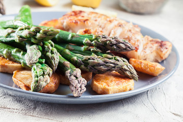 Fried cod fillet with green asparagus