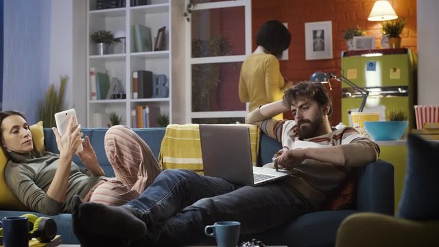 Friends connecting with their devices and ignoring each other