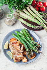 Fried cod fillet with green asparagus