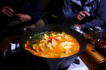 frying pan with vegetables and mushrooms