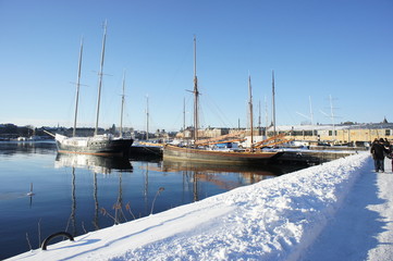 calm dock in sunny winter with snow on the floor