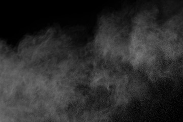 White powder explosion on black background.