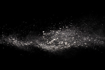 White powder explosion on black background.