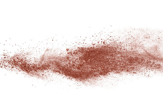 Brown color powder explosion on white background. 