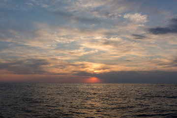 Naklejka na ściany i meble Beautiful sunset on the sea perfect background
