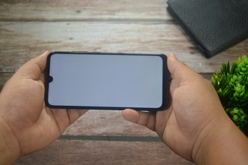 hands holding smartphone