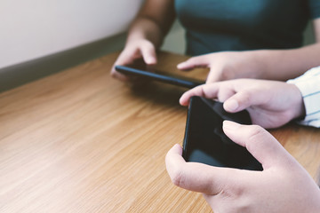Friends watching social media in a smart phone. social network concept with smart phone. white screen for mockup.