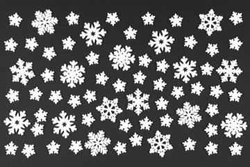 Top view of white snowflakes on colorful background. Winter weather concept with copy space. Merry Christmas concept