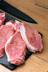 Pieces of different fresh meat on kitchen table