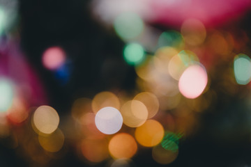 Abstract circle bokeh light background with decorations in holiday of Christmas.