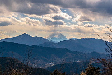 Mount Fuji seen from Mount Takao in spring with clouds