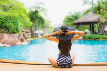 Portrait beautiful young asian women happy smile relax around swimming pool