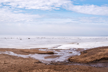 Fototapeta na wymiar Baltic coast in winter cloudy day