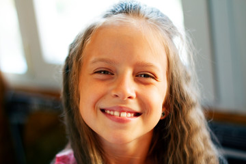 Beautiful young girl smiling. Happy holiday concept.