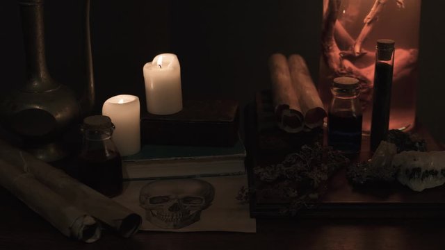Recreation of alchemy altar with occult and wichcraft artifacts and relics. No camera motion.
