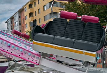 Attraction seat in an amusement park. Leather details and safety