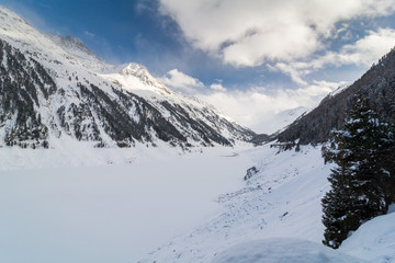 Fototapeta premium Beautiful view over mountain lake and mountains.View over the Kaunertal lake and valley in Kaunertal,Tyrol, Austria.