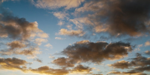 Naklejka na ściany i meble Natural blue cloudy sky background. Sunset sunrise time. Panorama image.