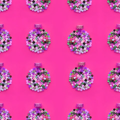 Christmas Bauble made of decoration elements on pink background. Flat lay. Contemporary design. Contemporary art. Creative conceptual and colorful collage.