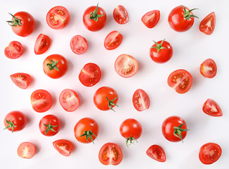 Ripe red cherry tomatos on white background. Flat lay