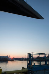 Sunrise at the shipyard. Shipbuiling. Superyacht. Yachting.Leaving the yard.
