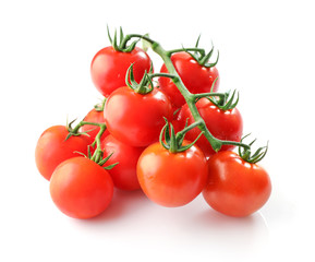 Branches of red ripe tomatoes isolated on white background