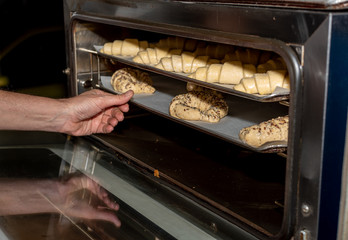 Croissants with cereals, and with chocolate, on a tray in a bakery in Madrid, Spain