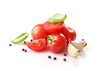 Ripe red cherry tomatos and spices isolated on white background. Top view