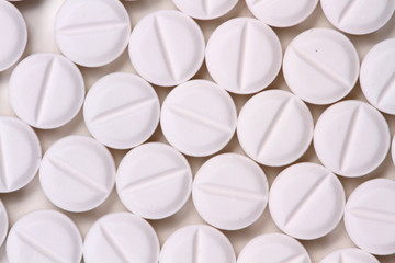 Drugs and medicines - different color pills on white background