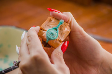 Jeweler working with wax model ring in his workshop. Craft jewelery making. Close up