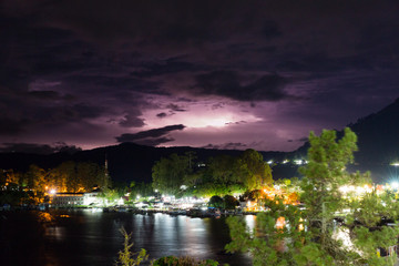 Lightning at night at the tropical tourist destination Tuktuk, on the island Samosir in Lake Toba, Sumatra, Indonesia