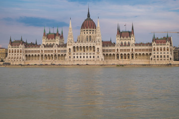 Fototapeta na wymiar View of historical building of Hungarian Parliament on Danube river in Budapest, Hungary, Europe.