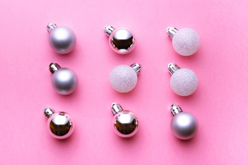 Xmas pattern. Christmas balls for decorations isolated on pink background. Flat lay. Abstract winter concept.