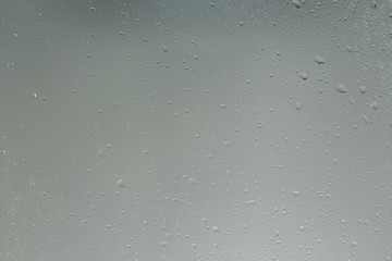 wet glass background condensate / abstract rain, drops texture on transparent glass