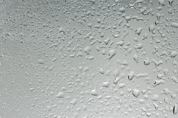 wet glass background condensate / abstract rain, drops texture on transparent glass