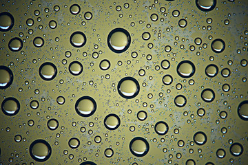 green wet background / raindrops for overlaying on a window, weather, background drops of rain water on a glass transparent