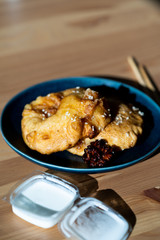 Fried Pineapple Fritters Caramelized with Cinnamon and Sesame Seeds.