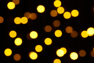 abstract background - photo of yellow bokeh on a black