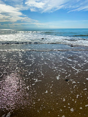 The shore of the Mediterranean Sea. Sandy beach.